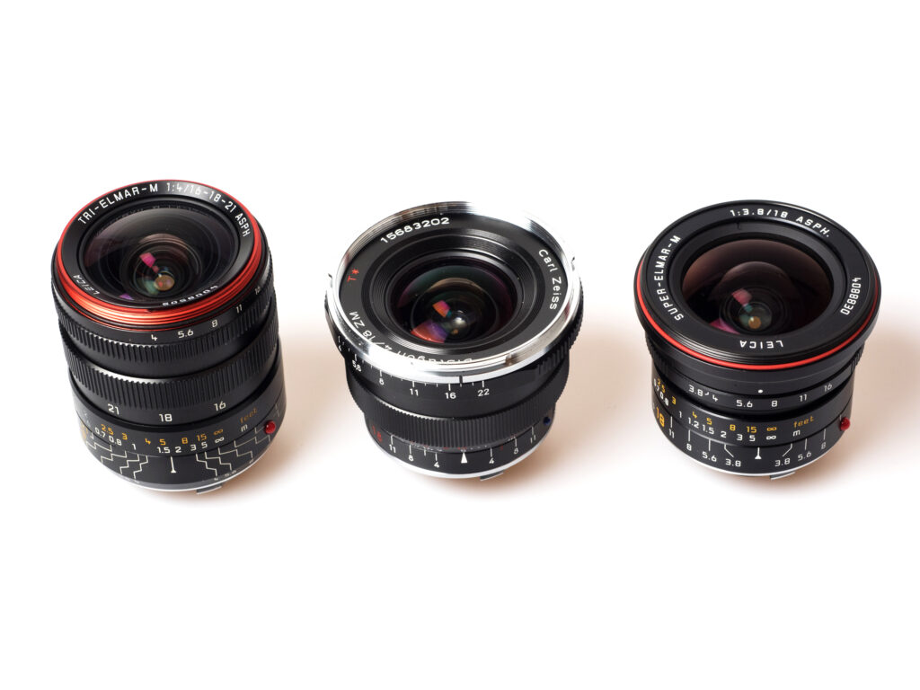 Produktfoto Leica Tri-Elmar 1:4/16-18-21 ASPH (WATE) mit 18-mm-Objektiven von Zeiss und Leica
